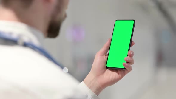 Male Doctor Using Smartphone with Chroma Screen