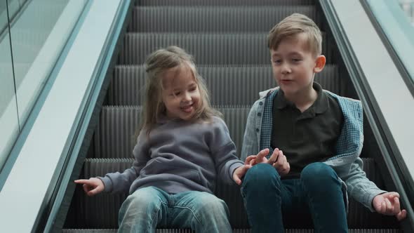 Brother and Sister on the Escalator