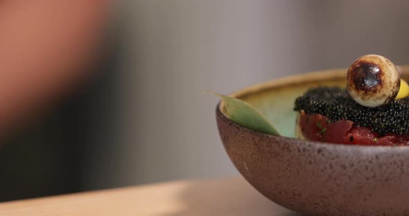 Close-up View Of Tuna Tartare With Black Roe (Caviar) And Quail Egg On Top As Garnish. - sliding sho