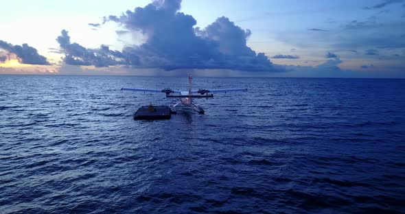 Luxury birds eye copy space shot of a summer white paradise sand beach and blue water background