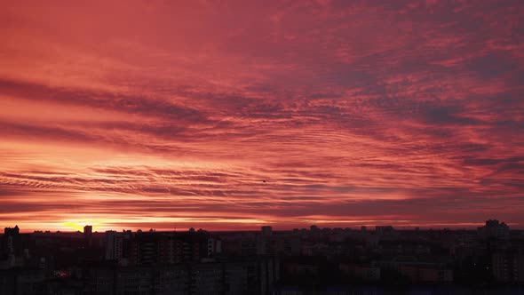 Incredible Panoramic Top View of Red Sunrise Over the Houses of the Big City