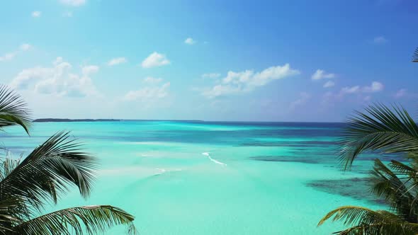 Aerial top down landscape of paradise coast beach vacation by transparent water with bright sand bac