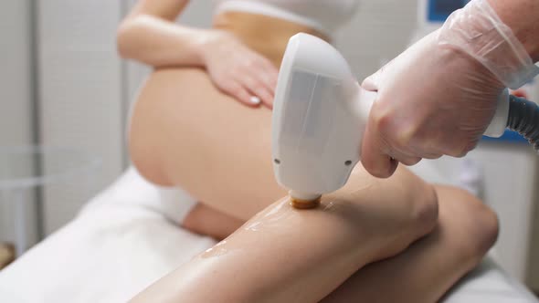 Slender Woman Get Hair Removal Procedure on Legs.