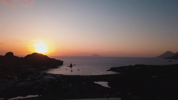 Aerial View on Lipari Islands with Trees and Buildings, Mountains. Moored Yachts and Sailing Boats