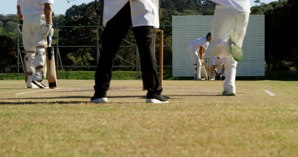 Bowler delivering ball during cricket match