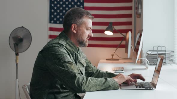U.S. Army Officer Working at Desk alt