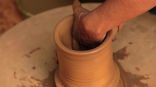 Potter at work makes ceramic dishes. India, Rajasthan.