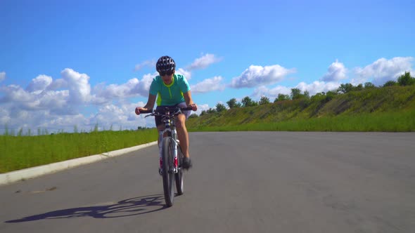 Road Bike Female Cyclist on a Bicycle