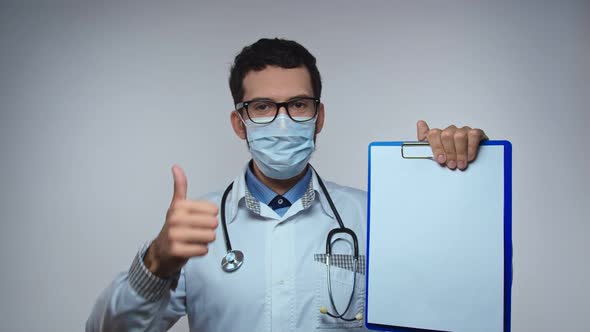 Happy Young Caucasian Doctor Showing Thumb Up