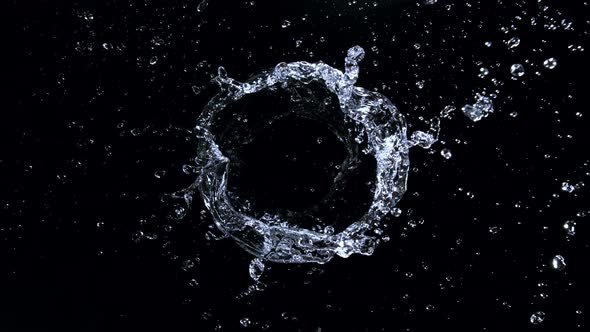 Super Slow Motion Shot of Rotating Water Ring Moving Towards Camera at 1000Fps