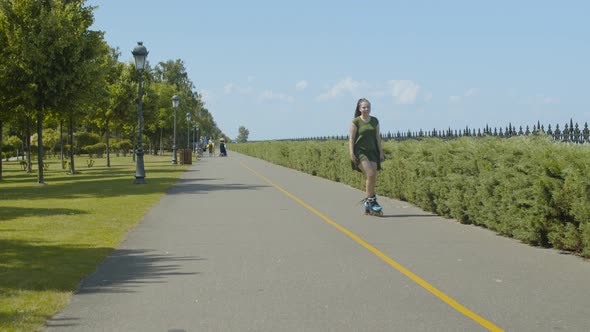 Carefree Female Enjoying Freeride on Roller Blades