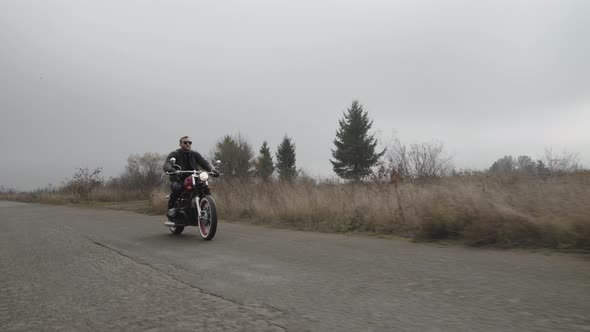 High Speed Riding on Motorcycle Out of City of Brutal Man