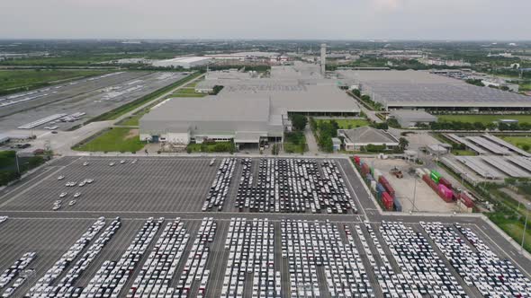 Aerial top view of new cars parking for sale stock lot row, dealer inventory import