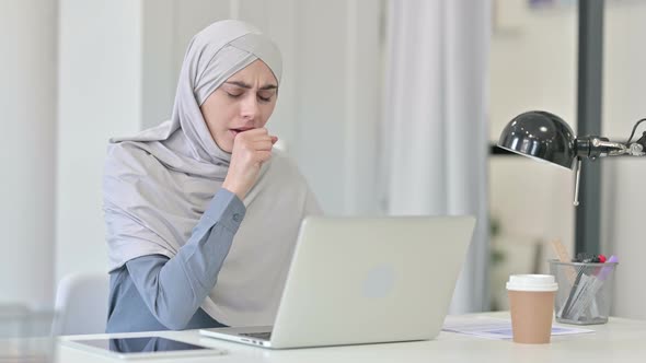 Young Arab Woman with Laptop Coughing