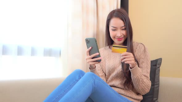 Young asian woman use smart phone