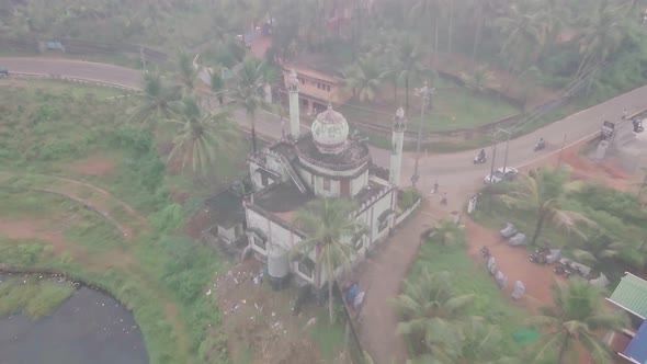 Hindu temple near Varkala in India at sunrise. Aerial drone view