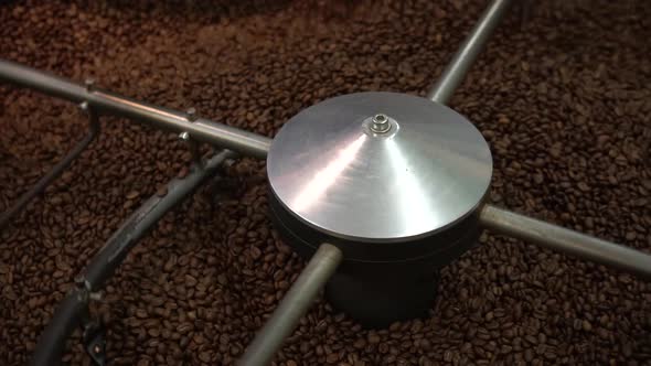 Freshly Roasted Coffee Beans in Circular Cooling Machine, Close Up Slow Motion