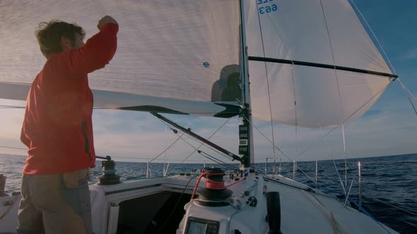 Professional Yachtsman on Sail Boat in Sea