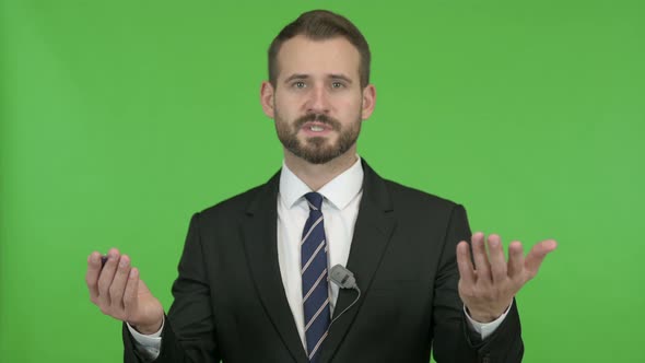 Ambitious Businessman Giving Presentation Against Chroma Key