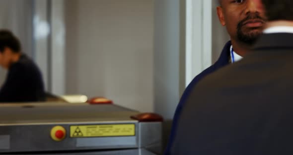 Airport security officer checking a passenger