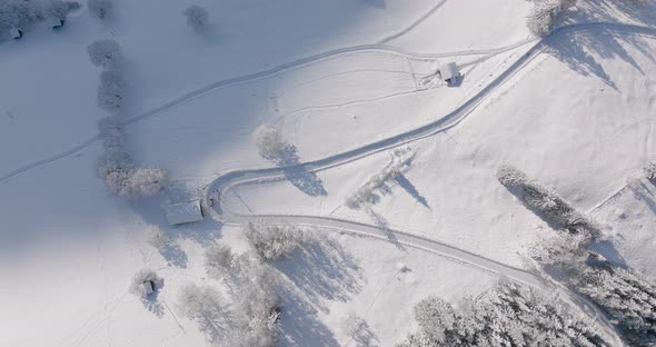 Drone Towards Winding Snowy Path On Kitzsteinhorn Mountain