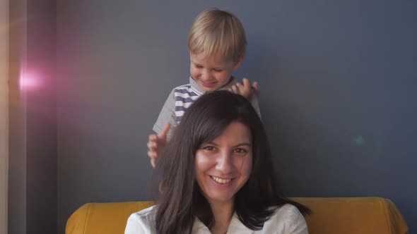 Naughty Child Playing With Mom Hair Portrait