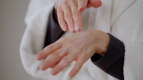 Closeup Mature Caucasian Female Hands Applying Moisturizer