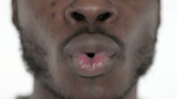 Close Up of Shocked African Man Mouth White Background