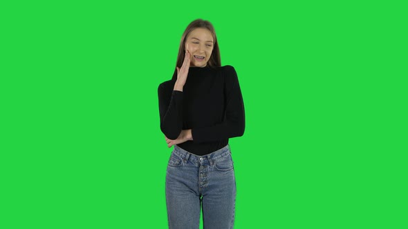 Awkward Teenage Girl Is Thinking About Something on a Green Screen