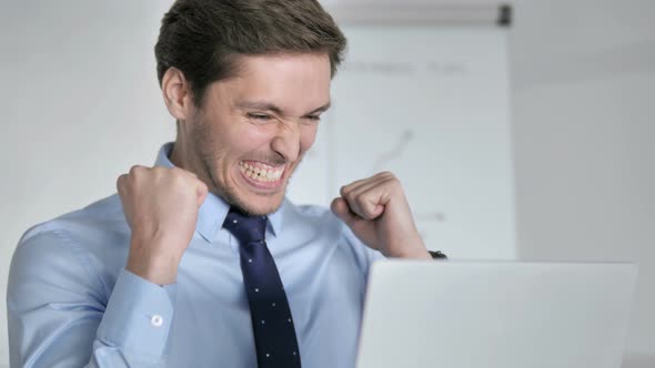 Close Up of Excited Businessman Celebrating Successful Project