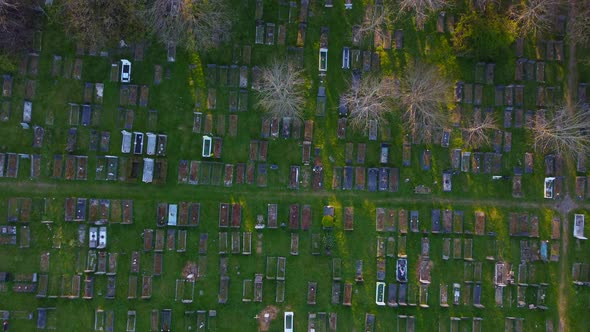 Drone Bird Eye View of Historic London Cemetery Amongst Trees at Sunset