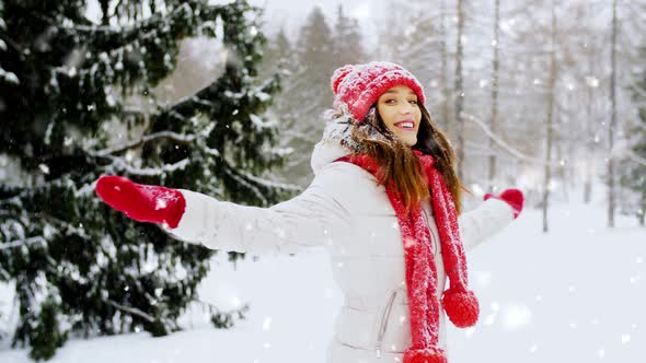 Happy Young Woman in Winter Forest