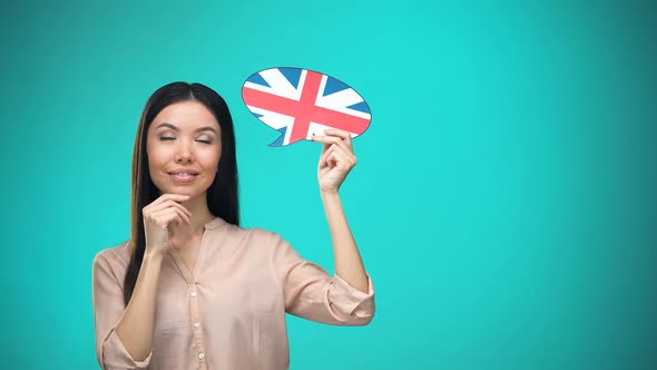 Curious Woman Holding British Flag Sign, Learning Language, Education Abroad