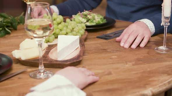 Close Up of Old Man and Woman Hand Touching While on a Date