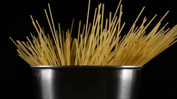 Bunch of Spaghetti Falls in a Pot