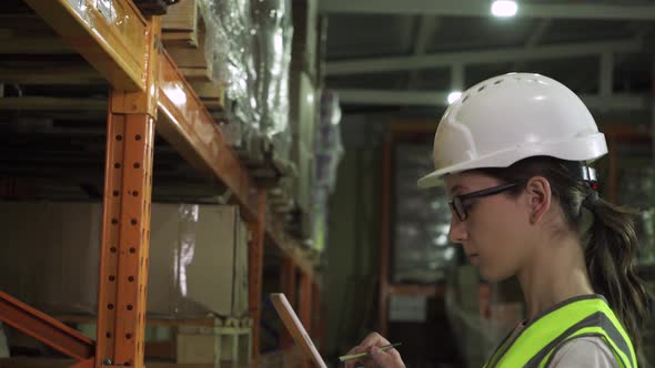 Female Supervisor in Safety Vest Helmet and During Factory Inspection