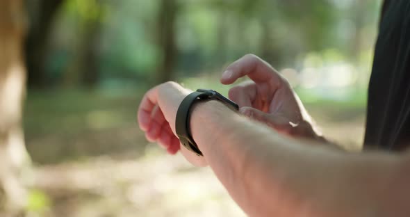 Males Hand Uses of Wearable Smart Watch at Outdoor