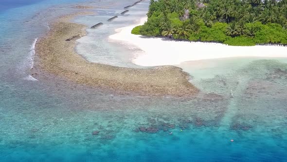 Drone sky of tourist beach trip by blue water with sand background