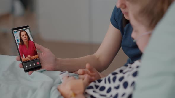 Sick Patient Resting in Bed with Mother Greeting Remote Friend During Online Videocall Conference