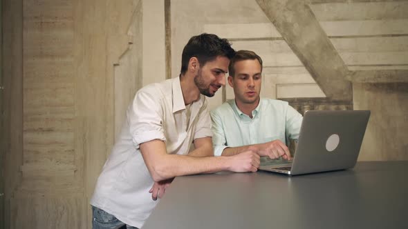 Two Young Businessmen Informal Meeting