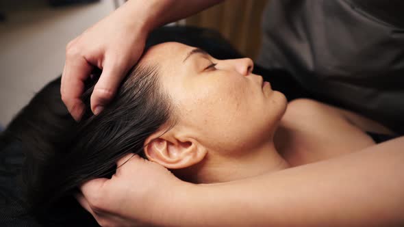 The Master Massages the Woman's Head