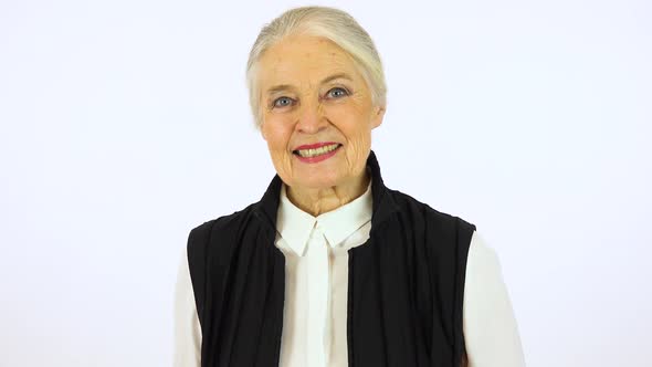 An Elderly Woman Smiles at The Camera