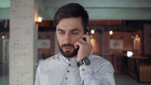 The Guy with the Beard Talks on the Phone