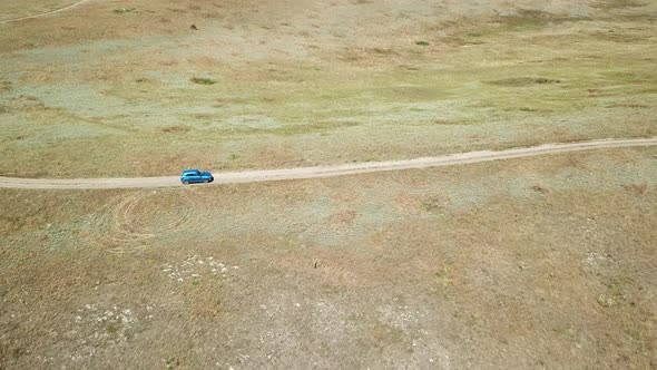 Aerial view. Cars go across the field. General's beaches, Crimea