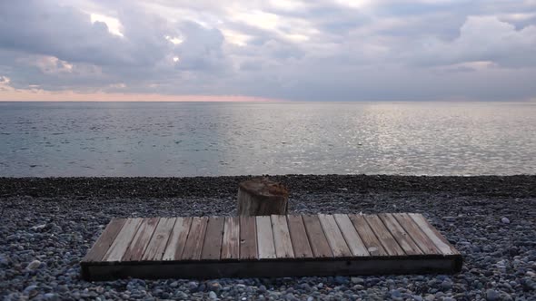 Empty Wooden Deckchair on the Beach