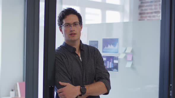 Portrait of man smiling at office