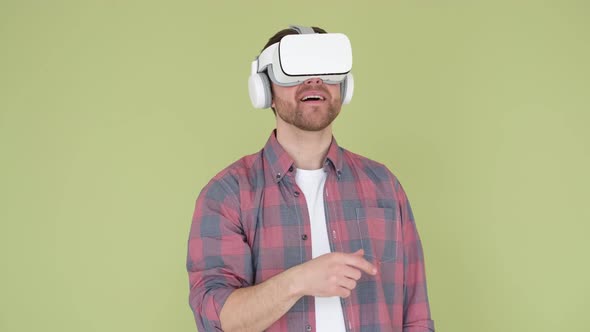 Adult Man in Vr Glasses on Camera Playing with 3D Visual Simulation