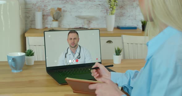 Woman Checks Possible Symptoms with Professional Physician, Using Online Video Chat. Young Girl Sick