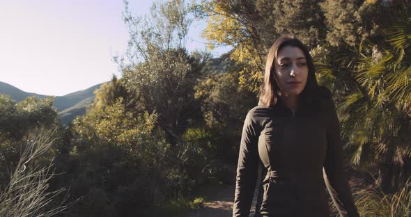 Beautiful Woman Walking Along Path