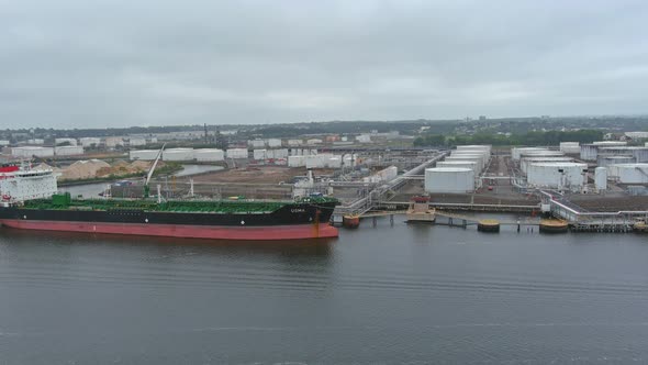 Oil Tanker the Process of Unloading Tanker in Port with Top View